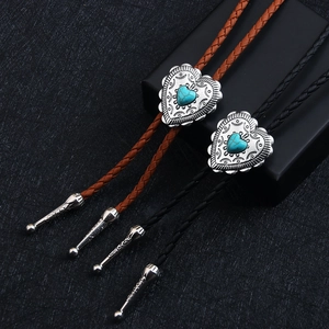 Punk vintage bolo tie featuring a silver heart-shaped blue turquoise pendant on leather rope