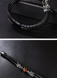 Close-up of double dragon heads woven leather bracelet with tiger eye stone and magnetic clasp