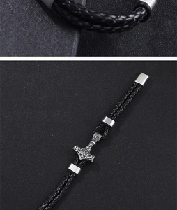 Detailed view of braided leather Viking bracelet with silver Thor's Hammer Mjölnir charm
