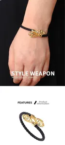 Détails du bracelet en cuir tressé avec fermoir tête de serpent dorée et yeux verts