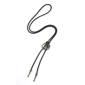 Retro American western bolo tie featuring a bronze cobra pendant on black braided cord
