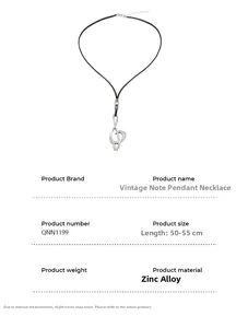 Macro view of vintage musical note pendant with detailed texture on zinc alloy finish