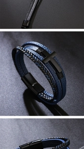 Detail of multi-layer leather bracelet featuring a black metal cross and magnetic clasp