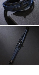 Close-up of multilayer leather bracelet featuring a black metal cross and magnetic clasp