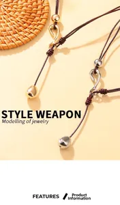Detail of multi-strand leather necklace with gold and silver charms and S-hook clasp