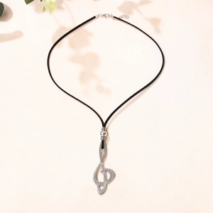 Vintage silver treble clef pendant on black cord necklace with adjustable lobster clasp