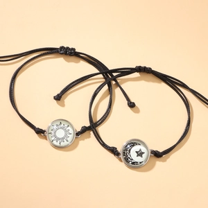 Pulseras de pareja ajustables sol y luna luminosas con cuerda trenzada negra en set de dos