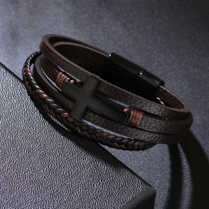 Multilayer leather cross bracelet with brown braided straps and black magnetic clasp