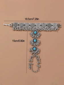 Bohemian silver slave bracelet with floral relief and turquoise beads detailing