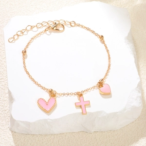 Bracelet élégant en chaîne dorée avec charms cœur et croix roses sur pierre
