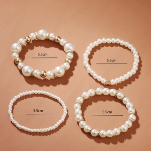 Four-piece pearl bracelet set with gold heart charms and elastic band, 5.5cm inner diameter
