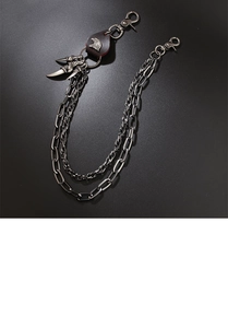 Detail of vintage silver punk pant chain with double metal links and eagle head charm