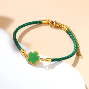 Green woven leather cord bracelet with gold clover pendant and 18k gold plating