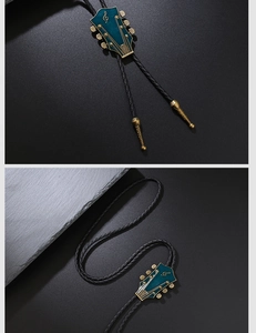 Detail of guitar headstock bolo tie with blue enamel, gold clef, and braided leather
