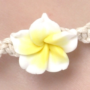 Fashionable woven anklet with yellow frangipani flower for beach holiday style