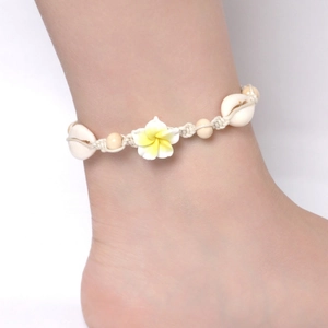 Handmade woven anklet with white plumeria flower and natural sea shells for beach style