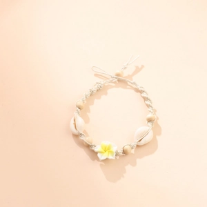 Handmade woven anklet with yellow frangipani flower, natural shells and wooden beads