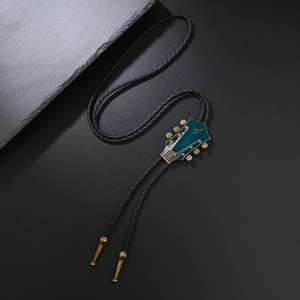 Vintage western bolo tie with blue enamel guitar head pendant on black woven cord
