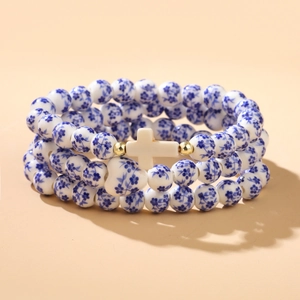 Three-layer blue floral ceramic bead bracelet with cross pendant and heart charm