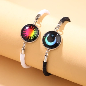 Luminous sun and moon couple bracelets set with woven straps and glowing crystal gems