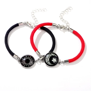 Magnetic sun and moon glowing couple bracelets with black and red braided ropes