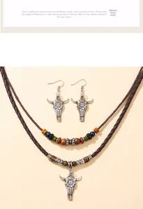 Detailed view of retro bull skull pendants on double-layered wooden bead necklace