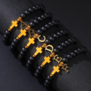 8mm matte black bead bracelet with gold cross and initial letter charm for women