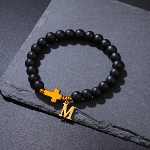 8mm black matte beaded bracelet with gold cross and letter M charm on stone