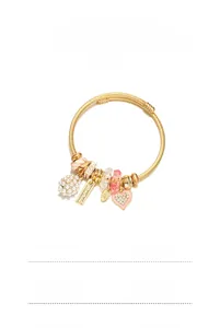 Detail view of gold beaded bracelet with peach blossom charms and white pearls
