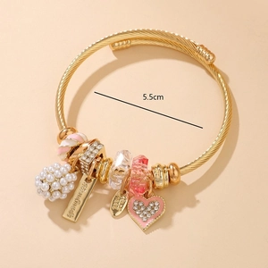Golden handmade beaded bracelet with white pearl clusters and pink heart pendant