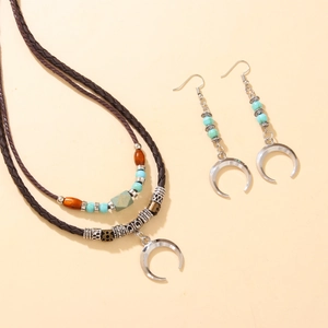 Vintage tribal jewelry set with moon pendant, turquoise beads, and woven leather cord