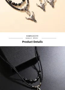 Détail du pendentif tête de taureau rétro avec collier en cordon tressé noir double couche