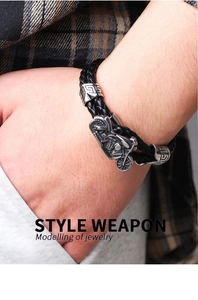 Detailed view of punk woven leather motorcycle bracelet with vintage steel charm