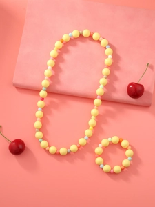Détails de l'ensemble collier et bracelet de perles jaunes aux couleurs de bonbons