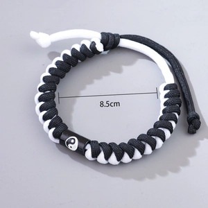 Handwoven black and white cord bracelet featuring a Tai Chi Yin Yang bead, 8.5cm size