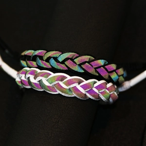 Set of black and white braided shoelace bracelets with holographic reflective finish