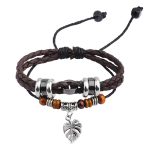 Multilayer braided leather bracelet with wooden beads and tropical leaf pendant charm