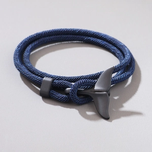 Minimalist double-layer braided cord bracelet featuring a matte black whale tail clasp