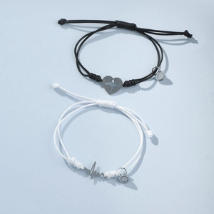 Détails des bracelets de couple réglables avec charme magnétique et cordes tissées