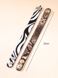 Detail of 22cm leopard and snakeskin pattern faux leather bracelets with metal snaps
