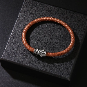Men's brown braided leather bracelet with vintage silver-toned embossed metal clasp