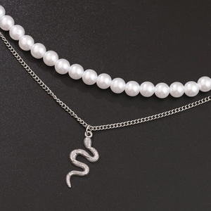 Double-layered hip hop necklace with white pearls and detailed silver snake pendant