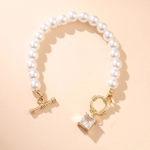 Elegant white pearl beaded bracelet featuring a gold OT clasp and square zircon pendant