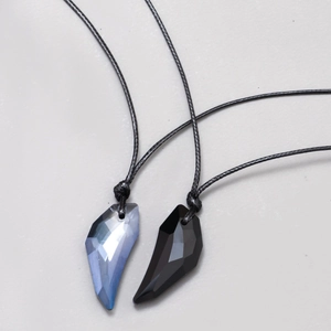 Wolf tooth crystal pendant necklaces with geometric cut in ice blue and black colors