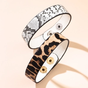 Set of leopard and snake print leather bracelets with adjustable metallic snap buttons