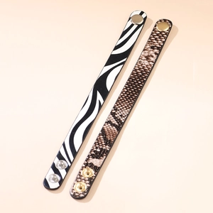 Adjustable leopard and zebra print faux leather bracelets with metallic snap buttons