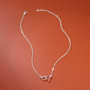 Minimalist S925 sterling silver interlocking double heart pendant necklace with adjustable chain