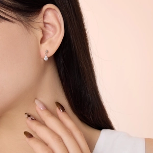 Close-up of elegant S925 sterling silver teardrop earrings featuring pear-cut zircon stones