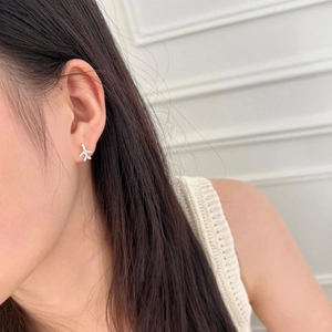 Elegant S925 sterling silver airplane stud earrings with zircon worn on female ear