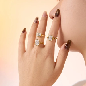 Three-piece S925 silver ring set with oval and emerald cut gemstones in gold bezel setting